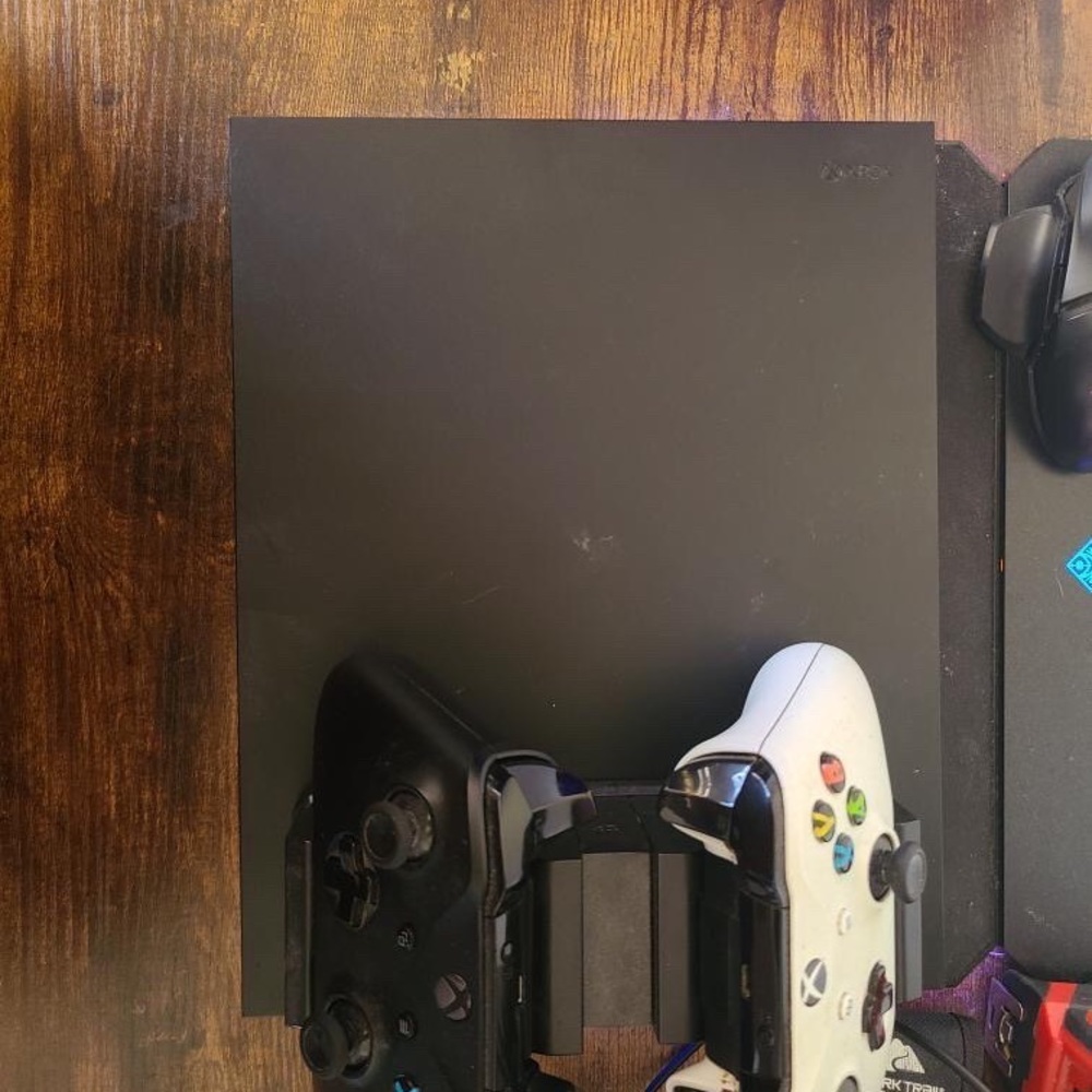 Xbox One X
1 terabyte
2 controllers 
2 battery packs and charger station